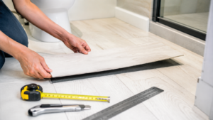 Peel and stick vinyl flooring in a modern renter-friendly kitchen makeover with pecan and off-white checker tiles.